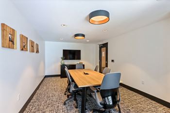Conference room with a wooden table and chairs